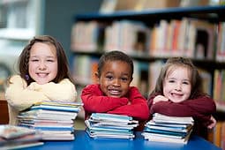 Colorful children's dictionaries on a shelf